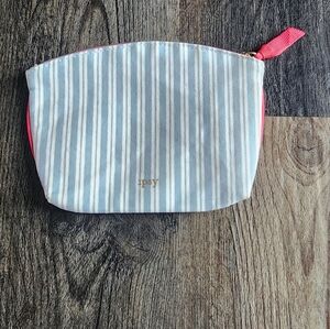 Empty Blue and White Ipsy Small Cosmetics Bag with Red zipper pull
